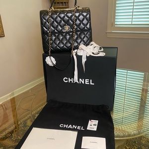 Chanel large top handle bag.